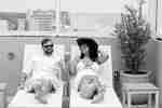 Guests Enjoying the Outdoor Pool Lounge Seating With View of Beach