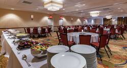 Spacious Ballroom with Chairs, Tables and Buffet Table