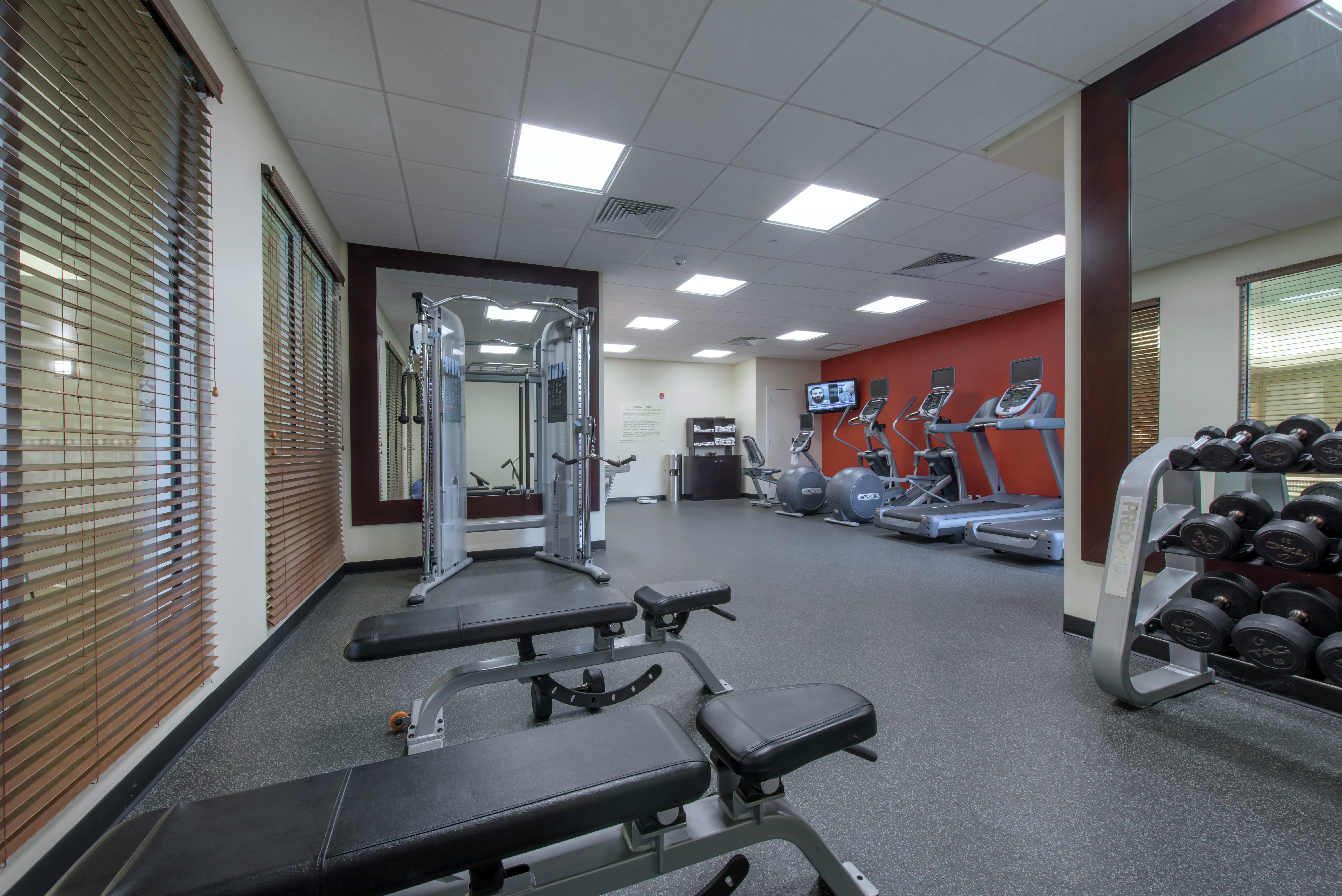 Fitness Center with Weight Benches, Weight Machine, Treadmills and Cross-Trainer
