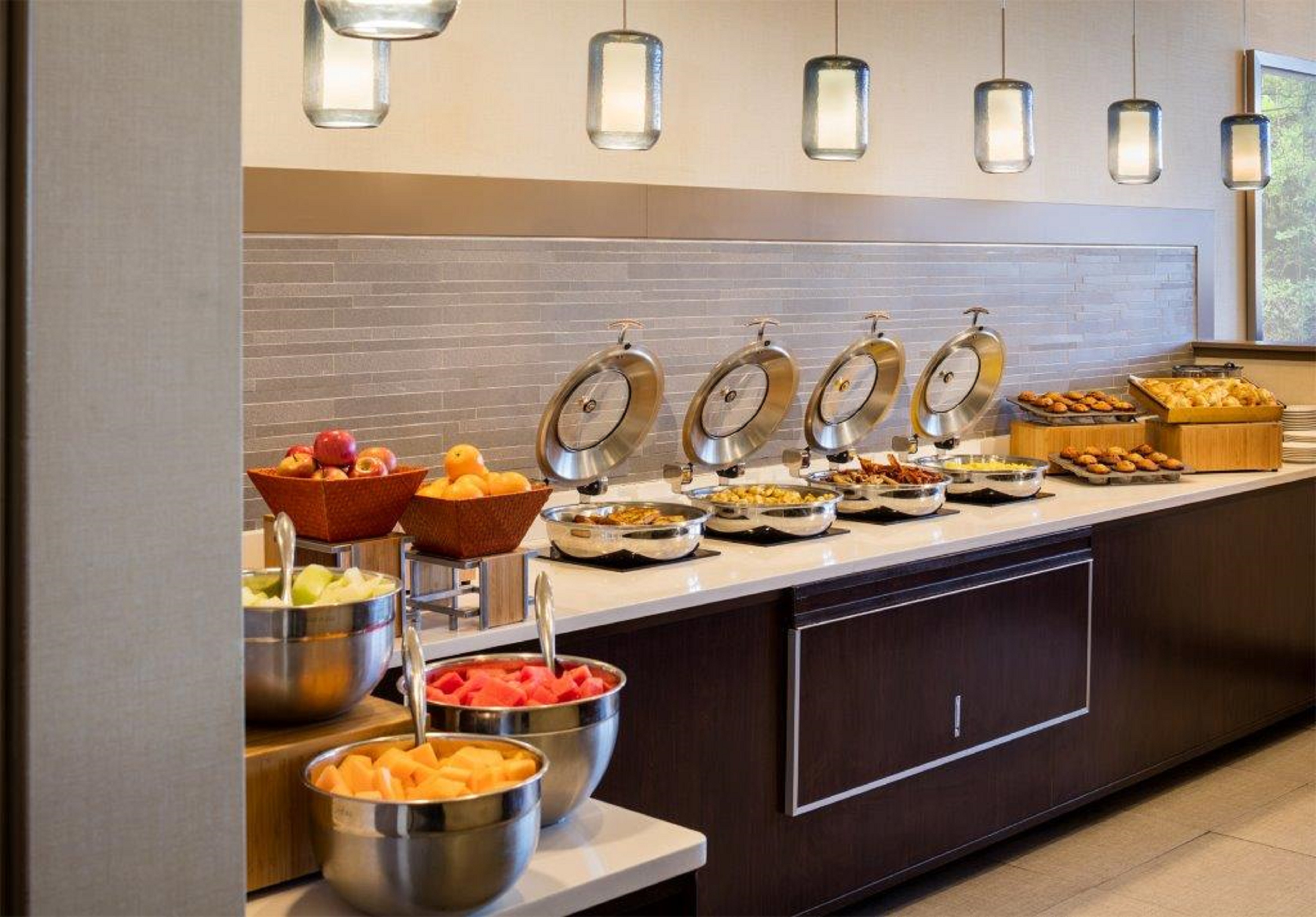 Breakfast Buffet with Fruits Breads and Hot Food Area