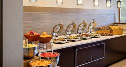 Breakfast Buffet with Fruits Breads and Hot Food Area