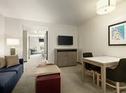 Urban Suite Living and Dining Area with HDTV, Sofa and Table for 2