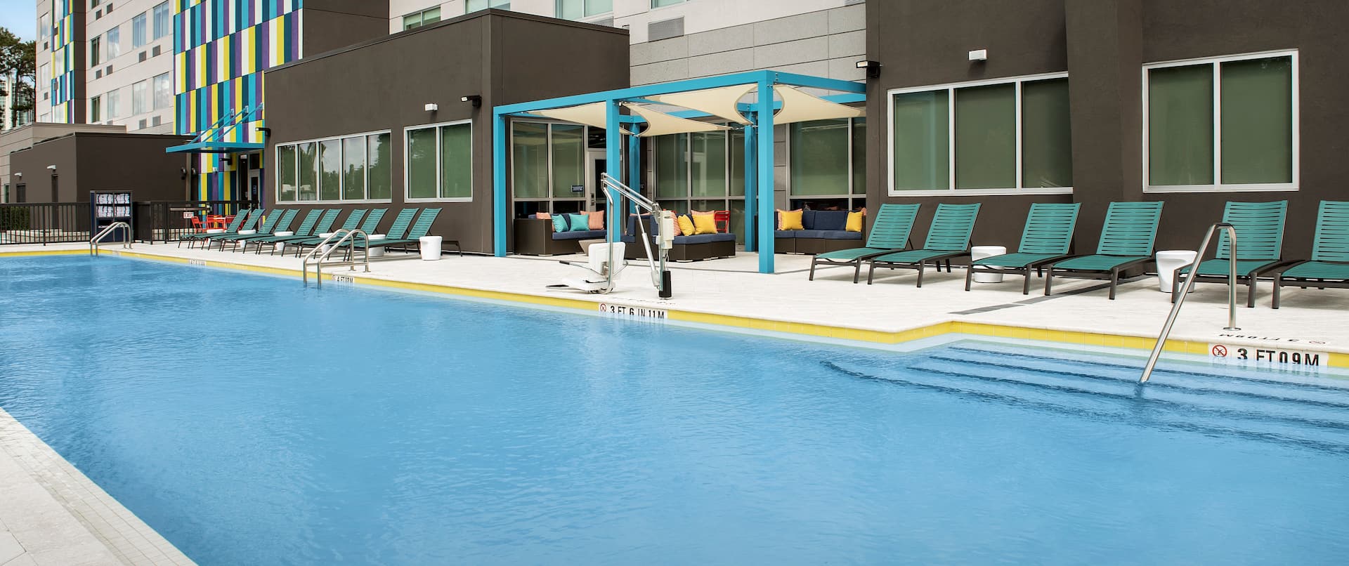 Outdoor Pool With Nearby Seating