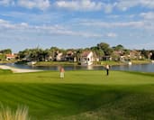 Grand Cypress golf course with two golfers putting