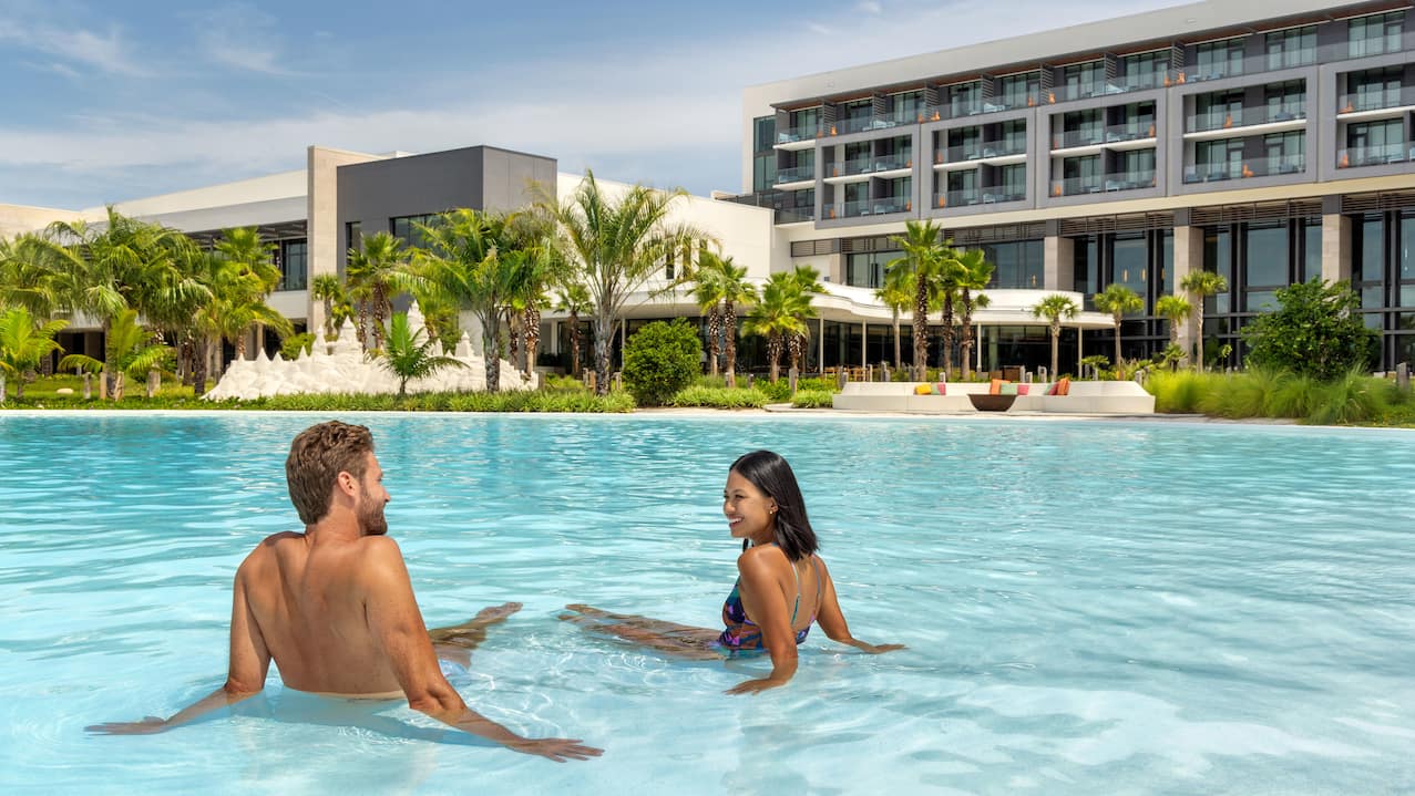 guests sitting in the outdoor pool