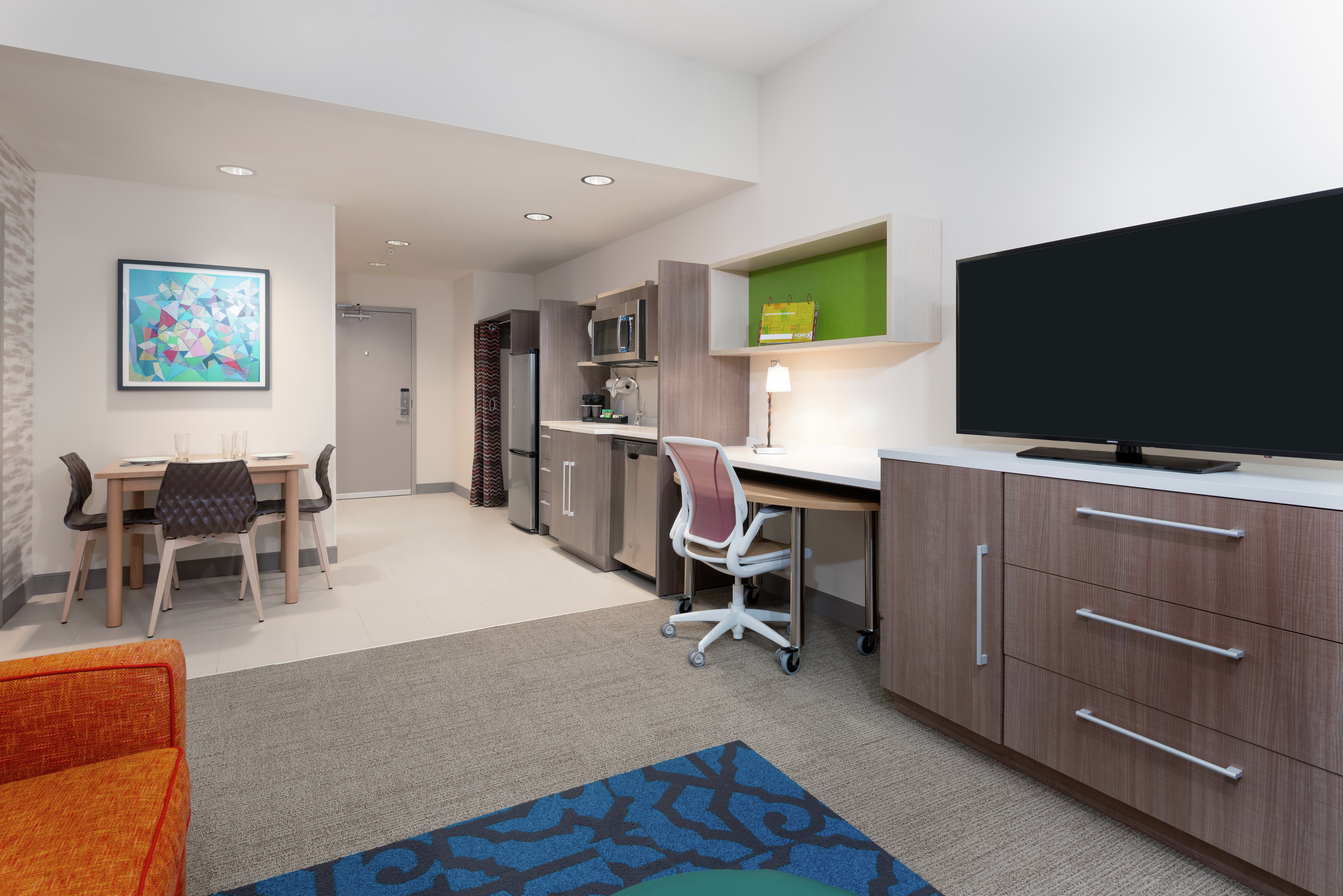 Suite Living Area with Work Desk, Room Technology, Kitchenette, and Dining Area