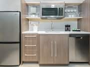 Studio Suite Kitchen with Microwave, Dishwasher, and Refrigerator