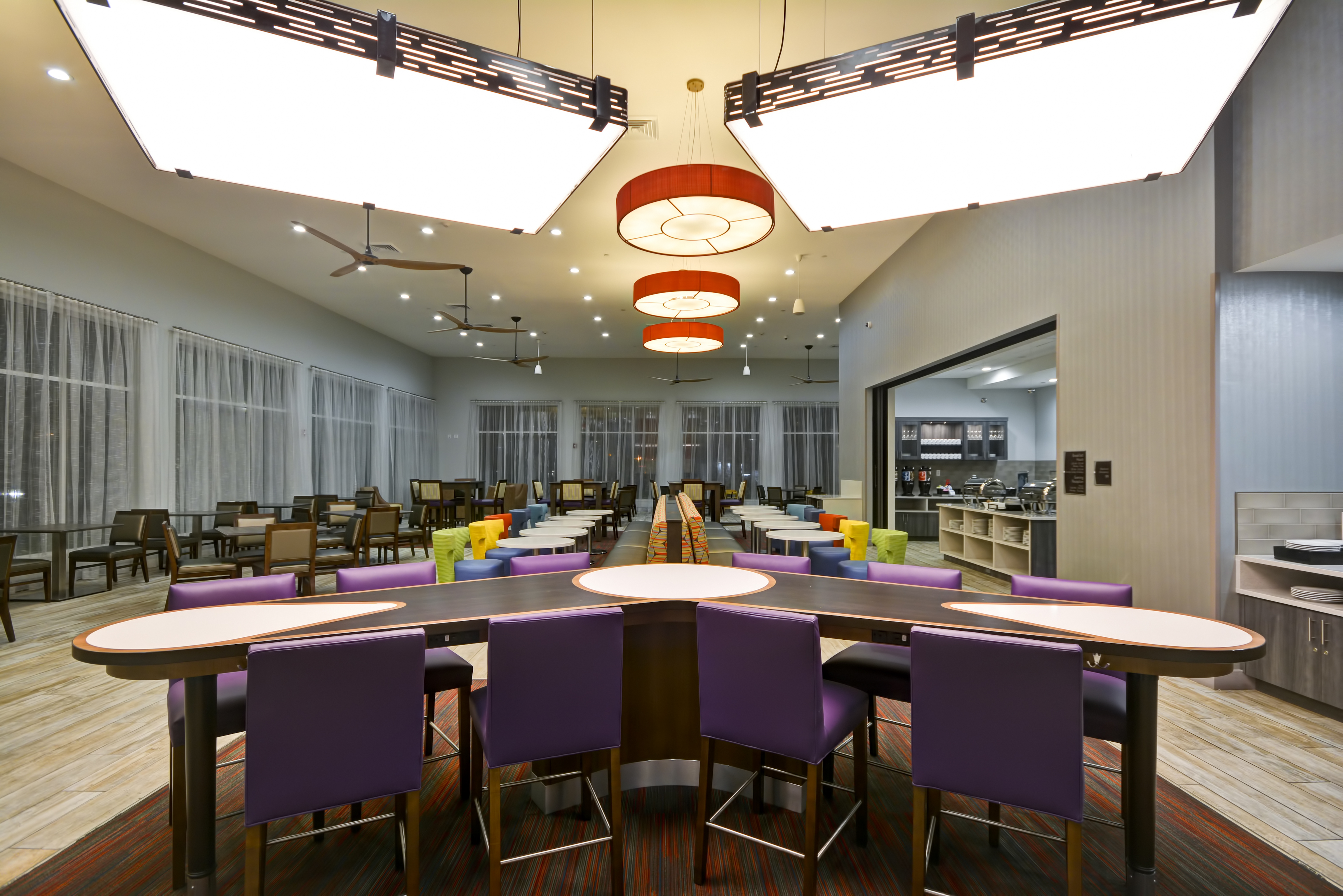 Homewood Suites by Hilton Orlando Theme Parks - Community Table with Purple Chairs