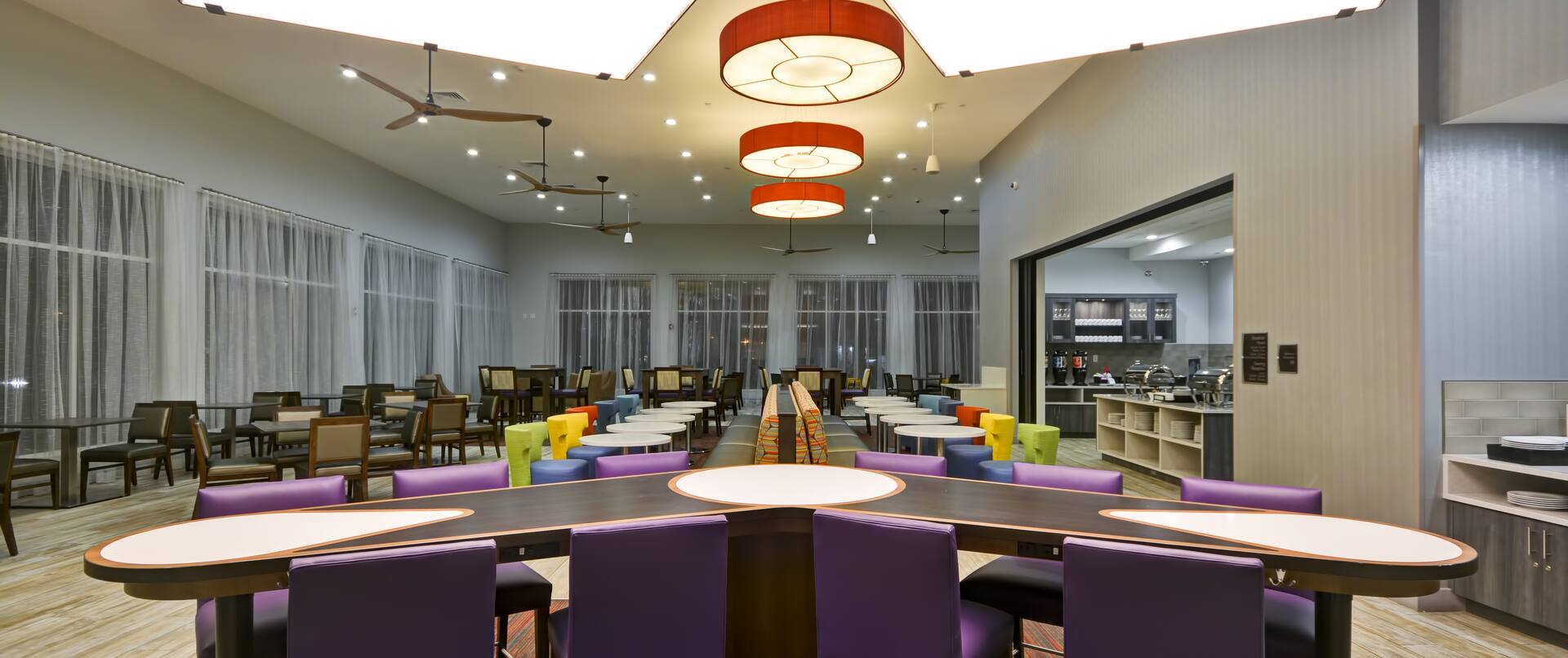 Homewood Suites by Hilton Orlando Theme Parks - Community Table with Purple Chairs