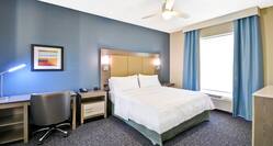 Homewood Suites by Hilton Orlando Theme Parks - King Suite Bed, Chair and Window