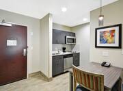 Homewood Suites by Hilton Orlando Theme Parks - Studio Kitchen With Table in Foreground
