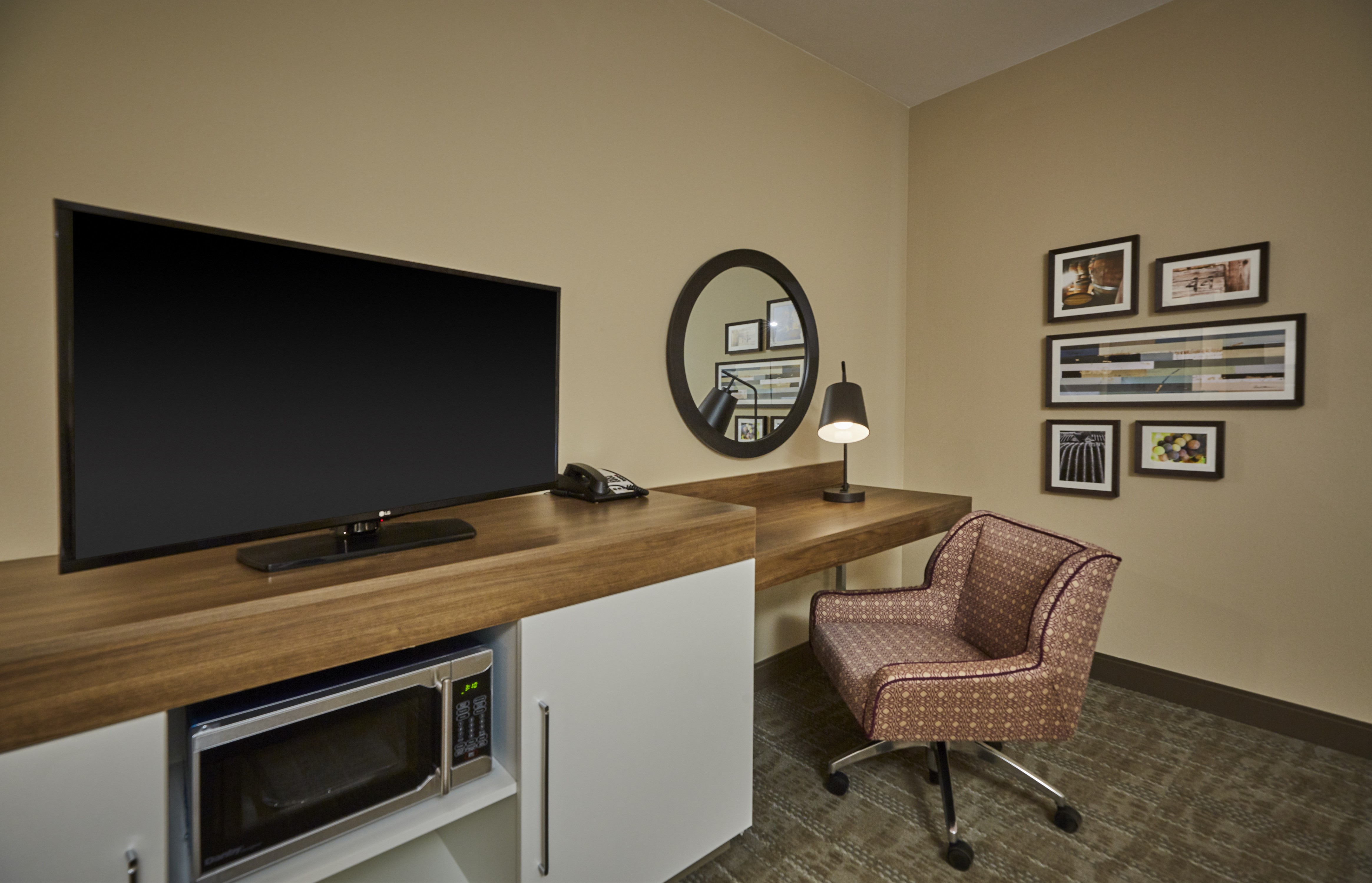 TV, Microwave and Work Desk Area of Guest Room