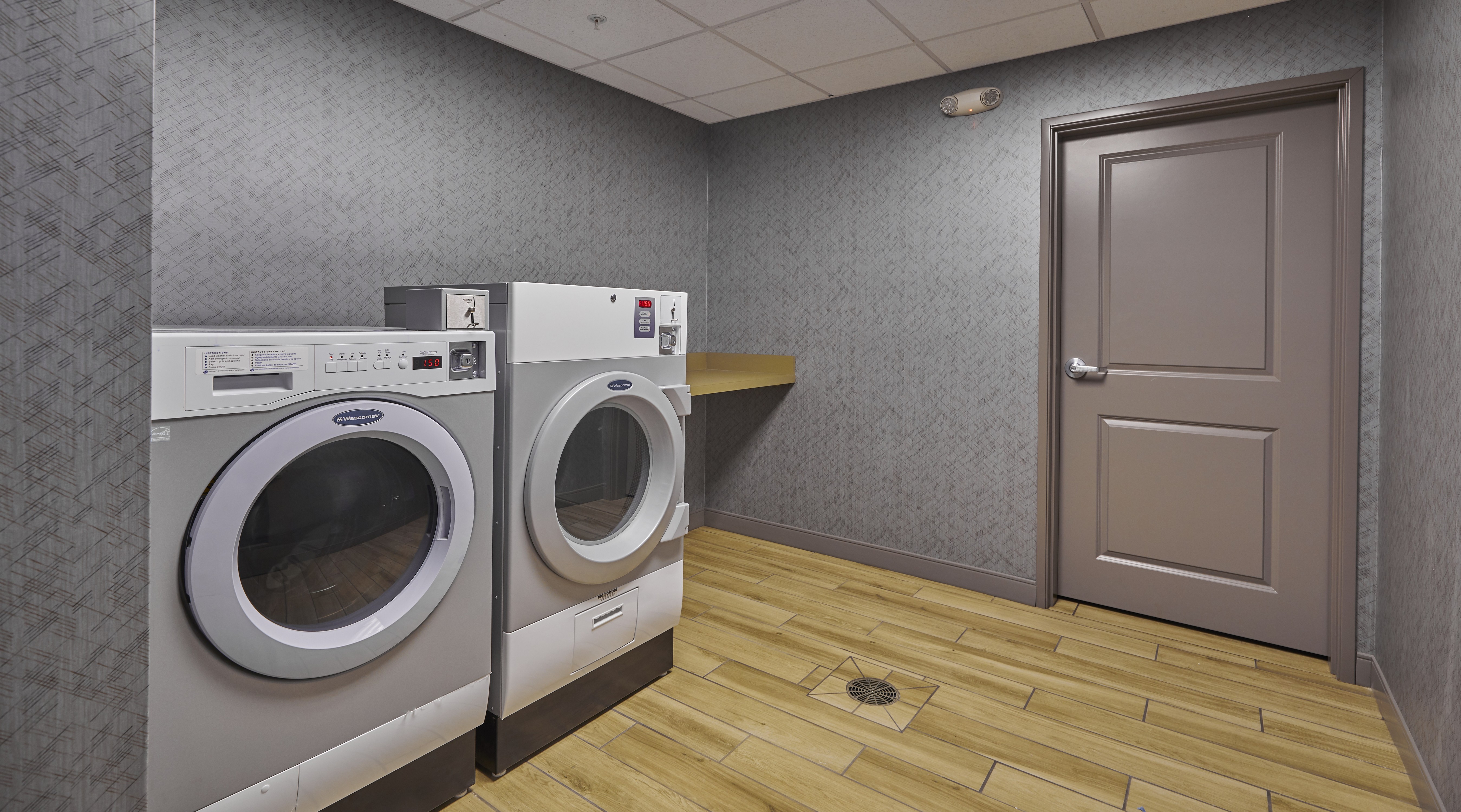 Laundry Room with Coin Operated Machines for Guest Use