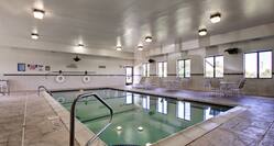 Indoor pools with tables and chairs