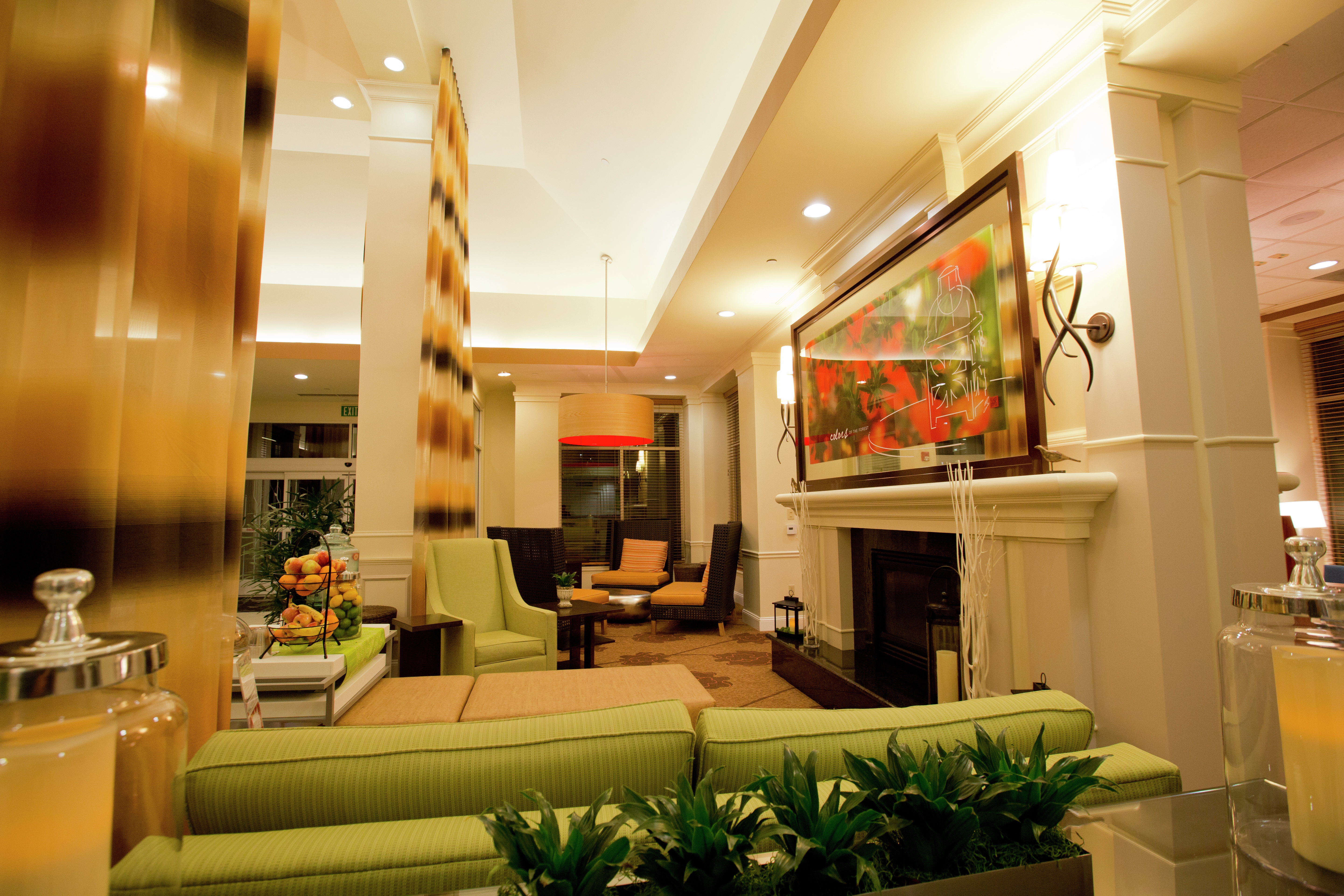 Long Drapes, Soft Seating, and Fireplace in Lobby Lounge Area