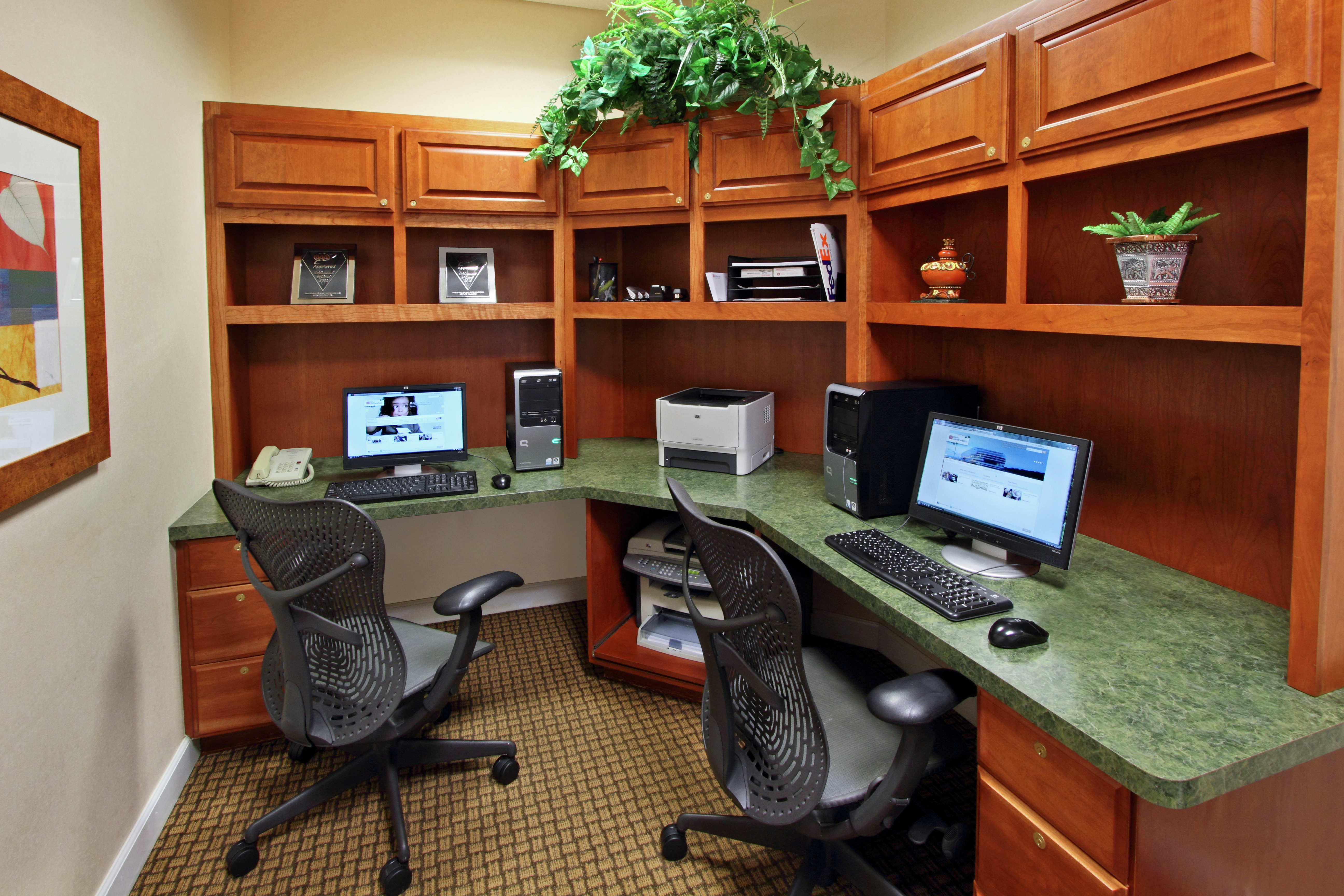 Business Center With Two Computer Workstations, Ergonomic Chairs, Printer, and Fax/Copier at Large Wooden Desk