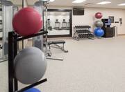Fitness center with exercise machines, free weights, and exercise balls