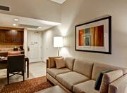 Suite Living Area with kitchen, dining table, lounge sofa, and room entrance