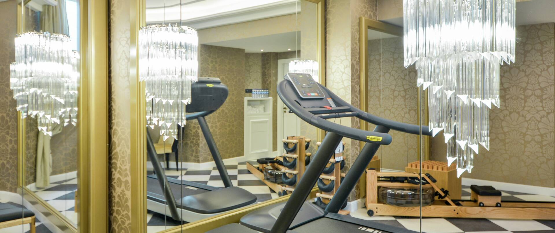Sport Lounge with Treadmill and Large Chandelier