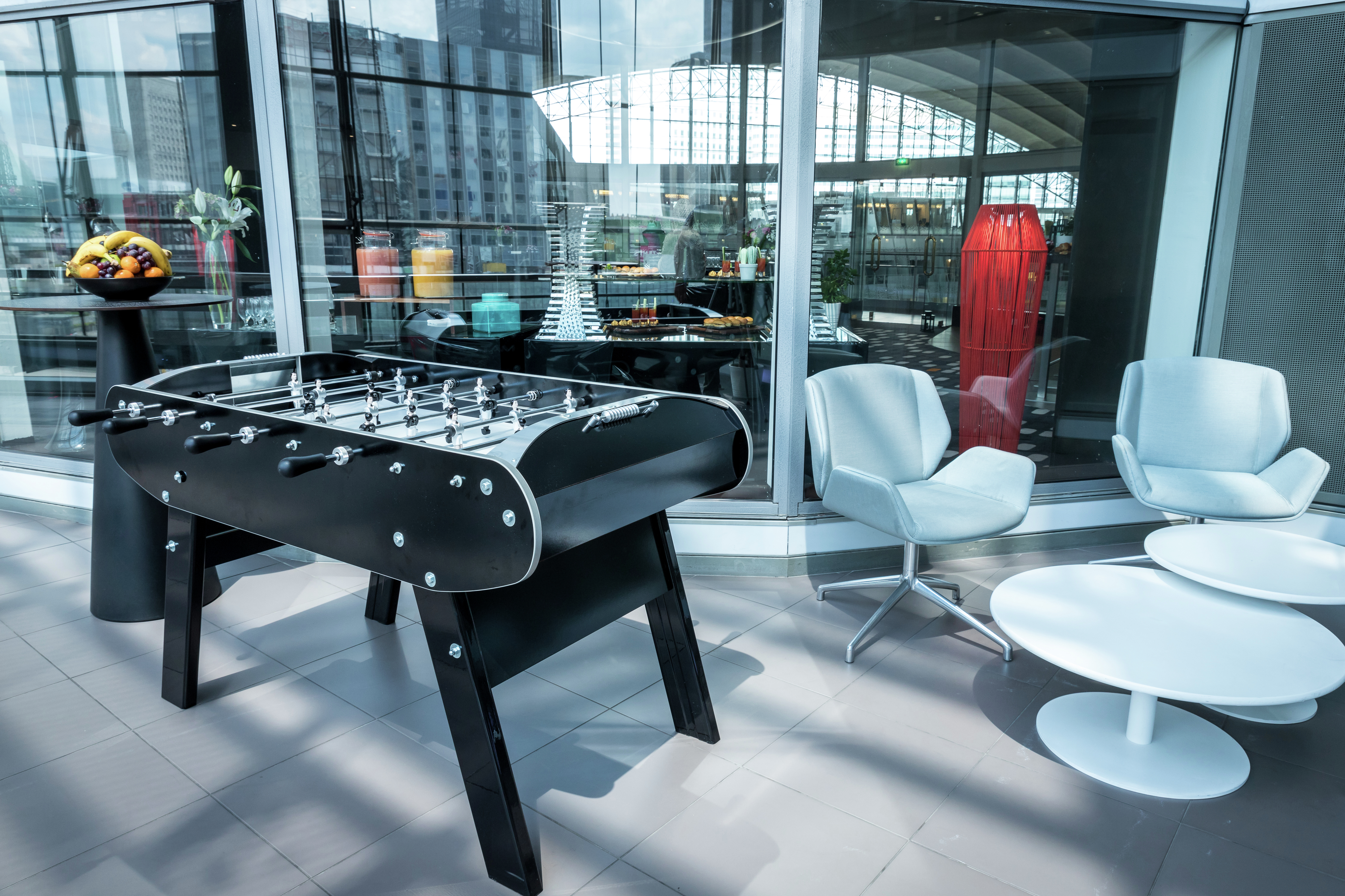Outdoor Bar Area with Fussball Table, Two Chairs and a Table