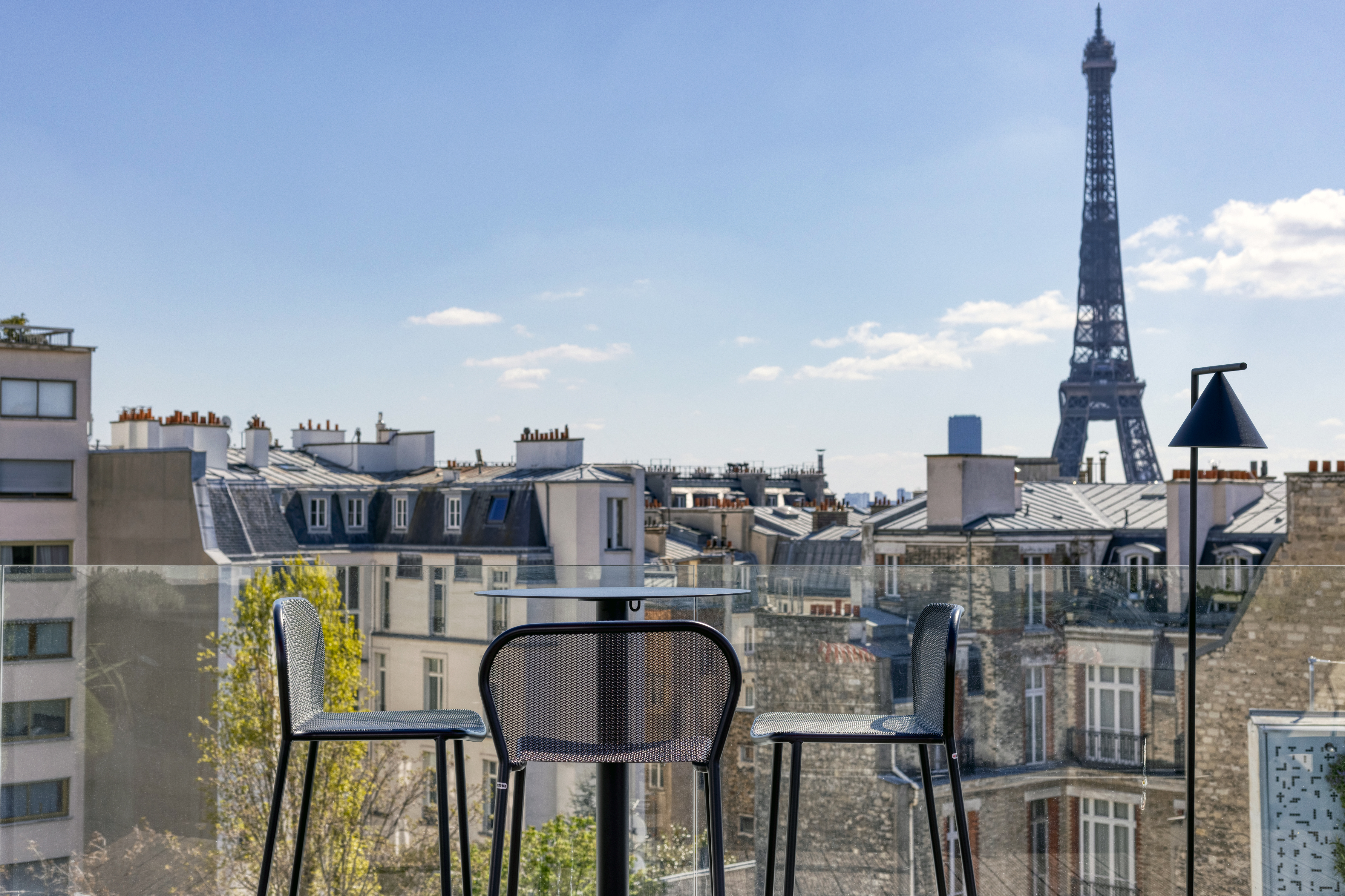 Table at Rooftop Bar with City and Eiffel Tower View