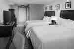 Two Beds and HDTV in a Guest Room with Desk Area