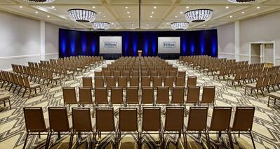 Spacious Ballroom Theater Setup with Two Projector Screens