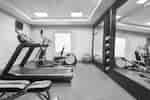 Convenient on-site fitness center for guests fully equipped with cardio machines and free weights.