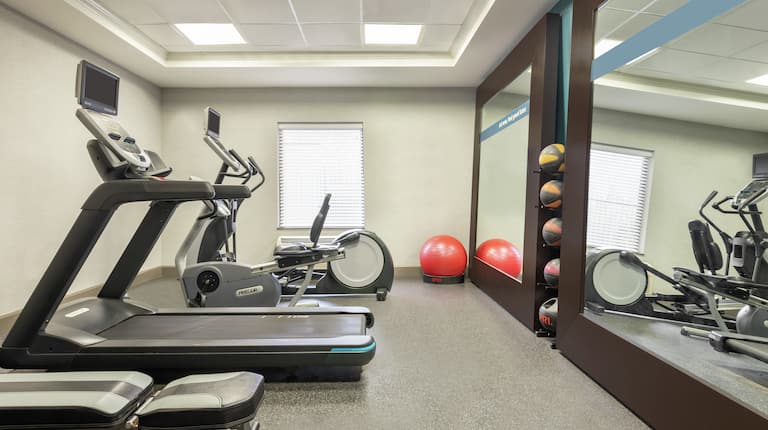 Convenient on-site fitness center for guests fully equipped with cardio machines and free weights.