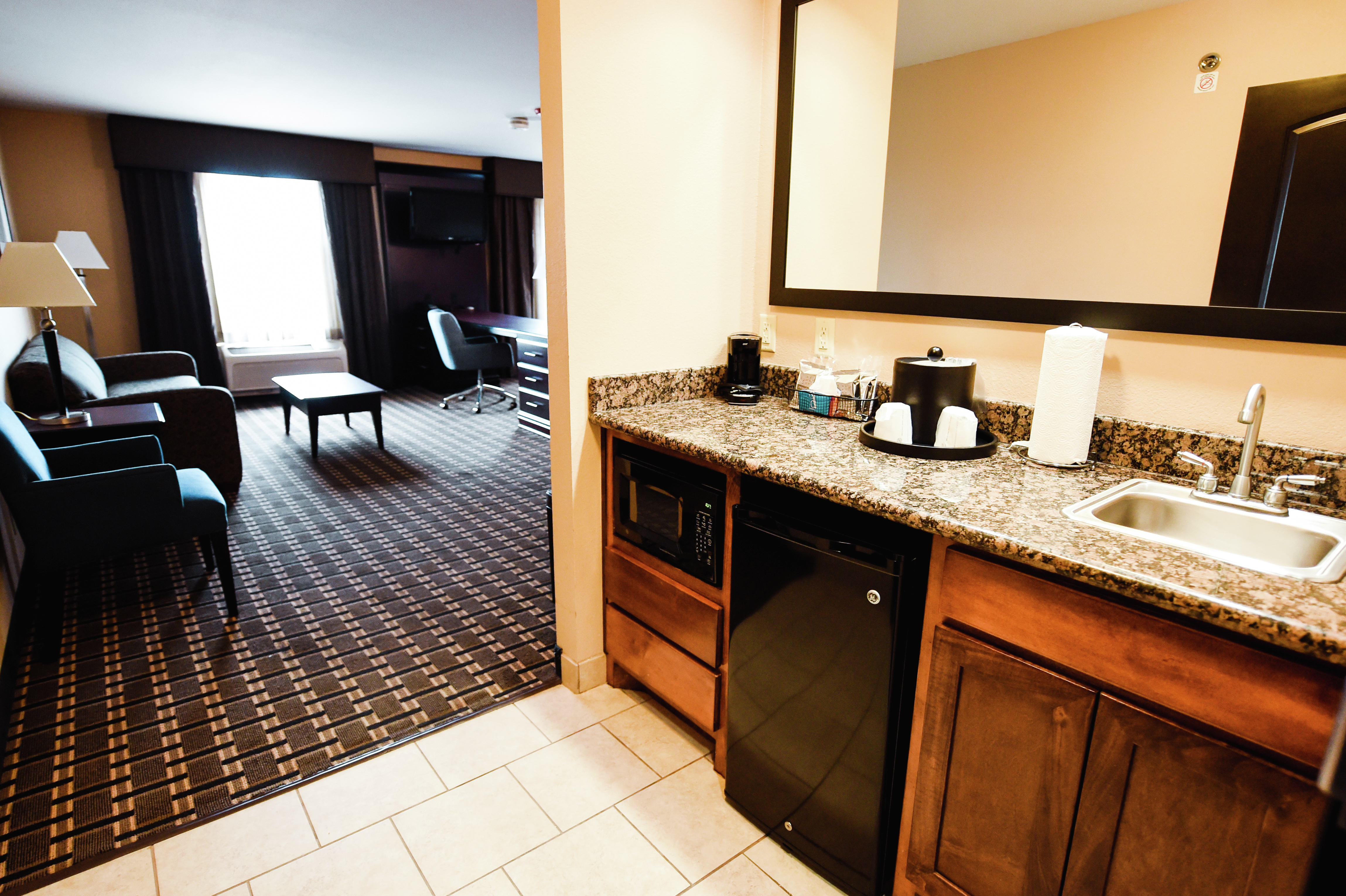 Wet Bar Area and Partial View of Living Area in Suite