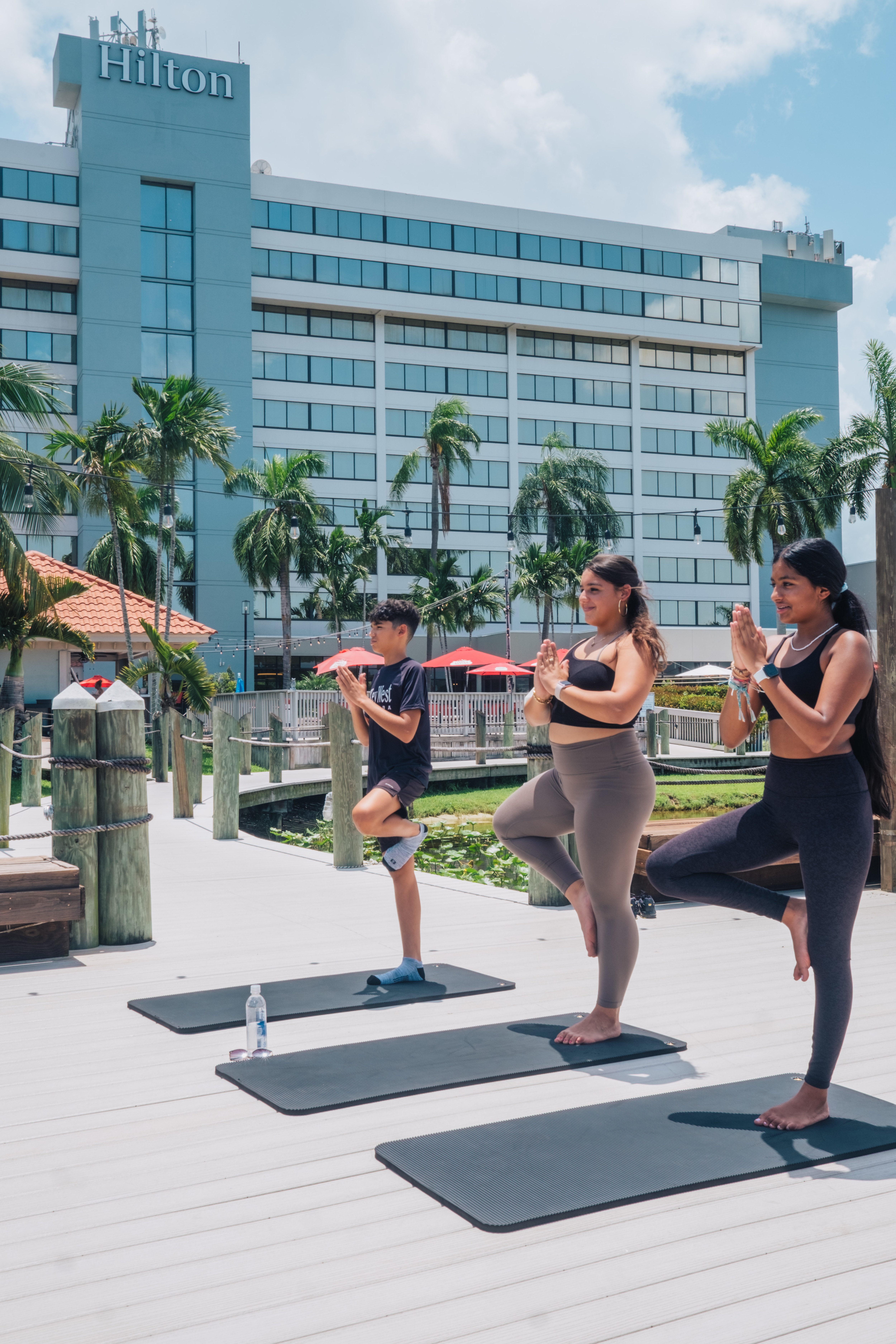 Hotel exterior with people doing yoga