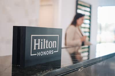 Front desk area with Hilton honors signage