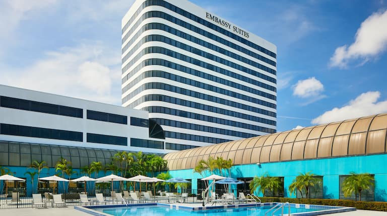 Outdoor Pool Area and Embassy Suites Hotel Exterior
