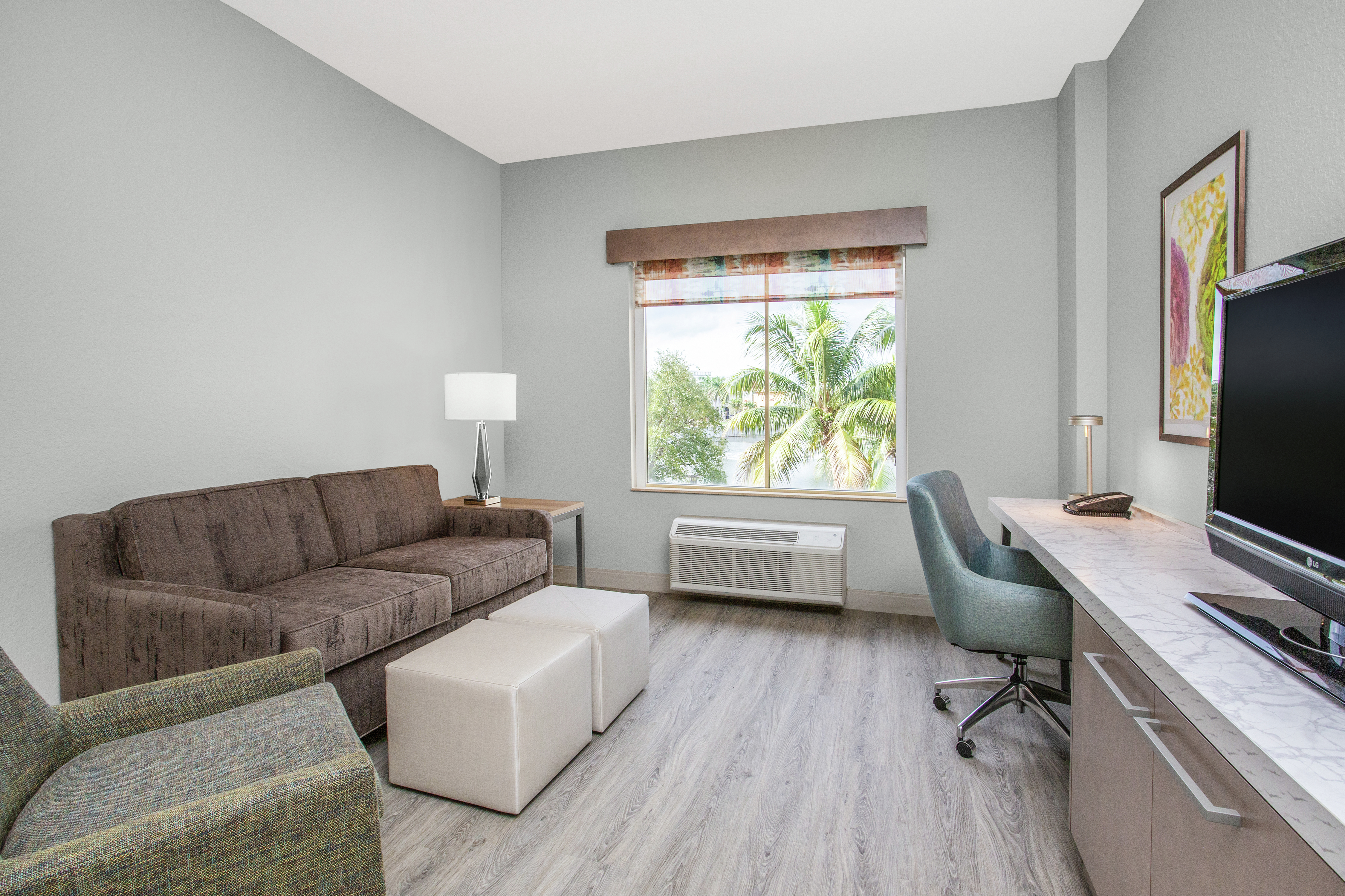 Accessible King Suite Guestroom with Lounge Area, Outside View, Work Desk, and Room Technology
