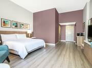 Accessible King Guestroom with Bed, Lounge Area, Room Technology, and Kitchenette
