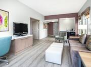 King Junior Suite Guestroom with Kitchenette, Lounge Area, and Room Technology