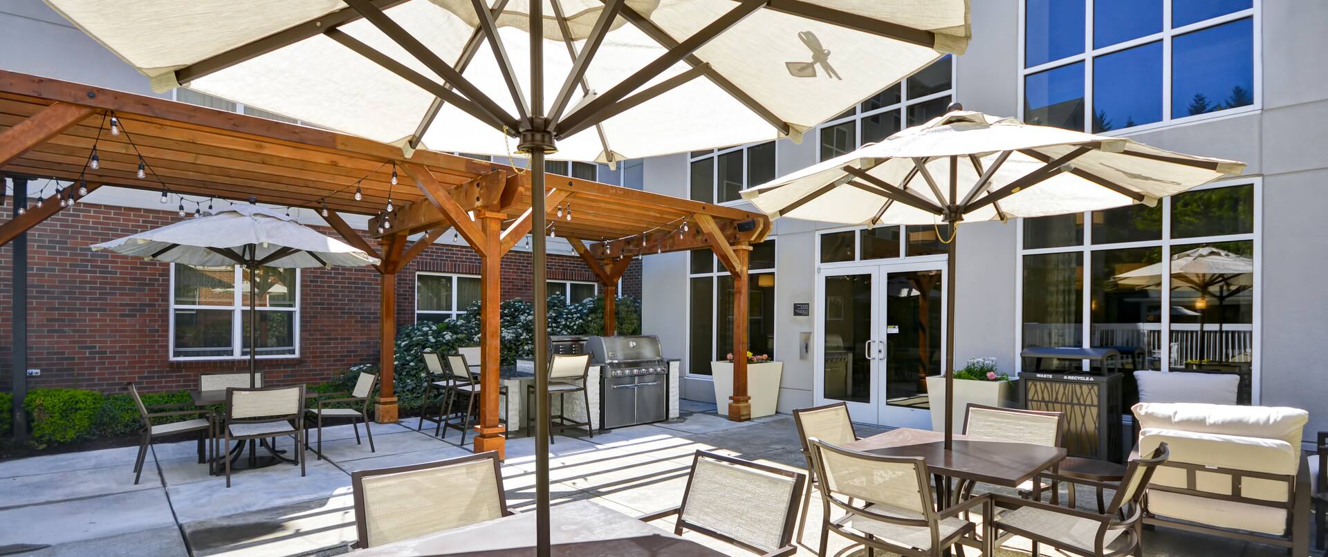 Patio Area with Seating and Umbrella Tables