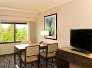 Guestroom Living Area with Work Desk, Television and Outside View