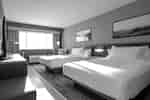 Two Queen Bed Guestroom with TV and Lounge Area