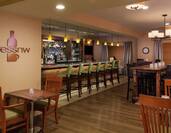 Signage, Wall Clock, Tables With Candles, Chairs, TVs and Counter Seating at Fully Stocked PressNW Bistro & Bar