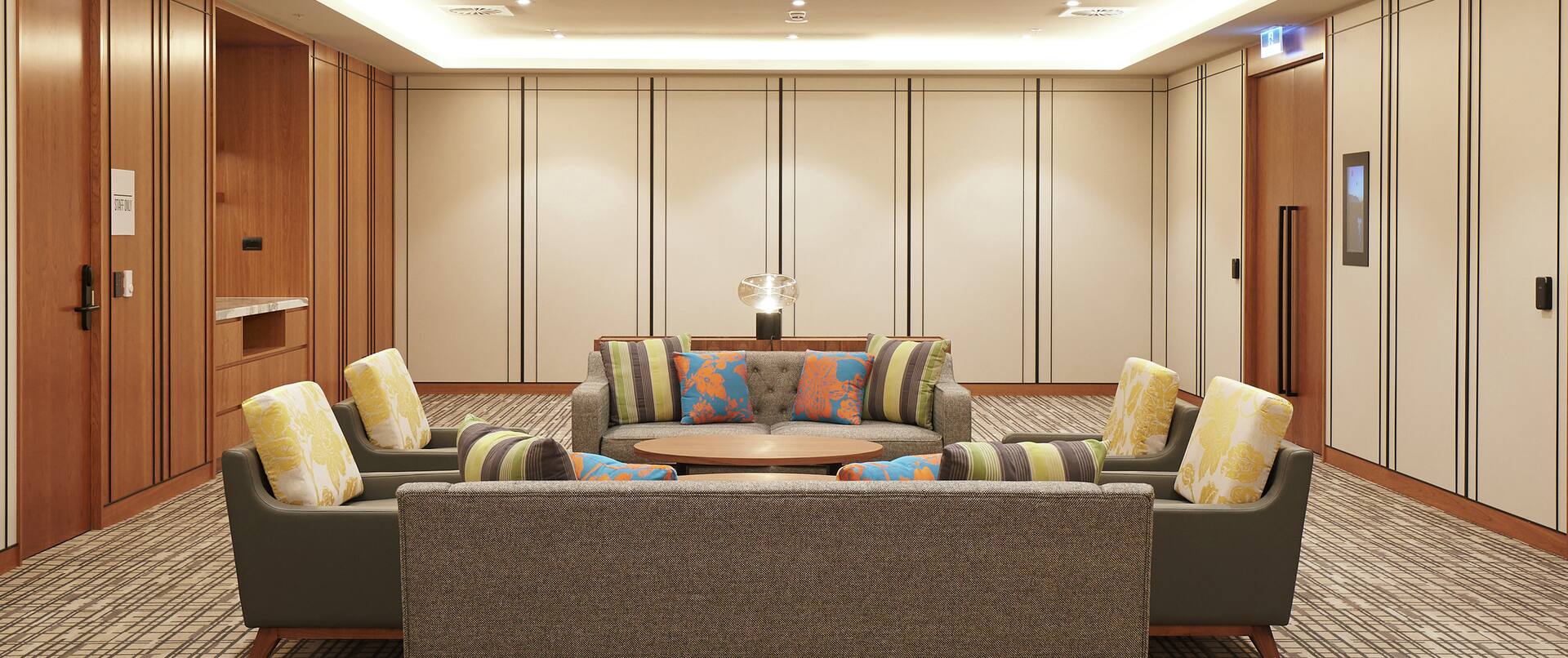 Meeting Room with Couches, Chairs, and a Round Table