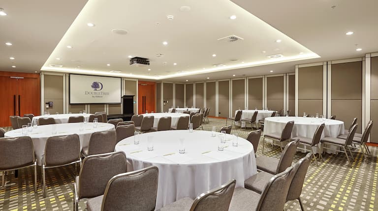 Jarrah Meeting Room with Tables and Chairs Cabaret Style with Projector Screen