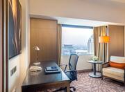 King Hilton Guestroom Plus, With Work Desk, Lounge Chair, and Window With Outdoor View