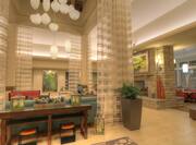 Long Drapes, Decorative Lighting, Soft Seating, Beverage Stations and Fireplace in Lobby