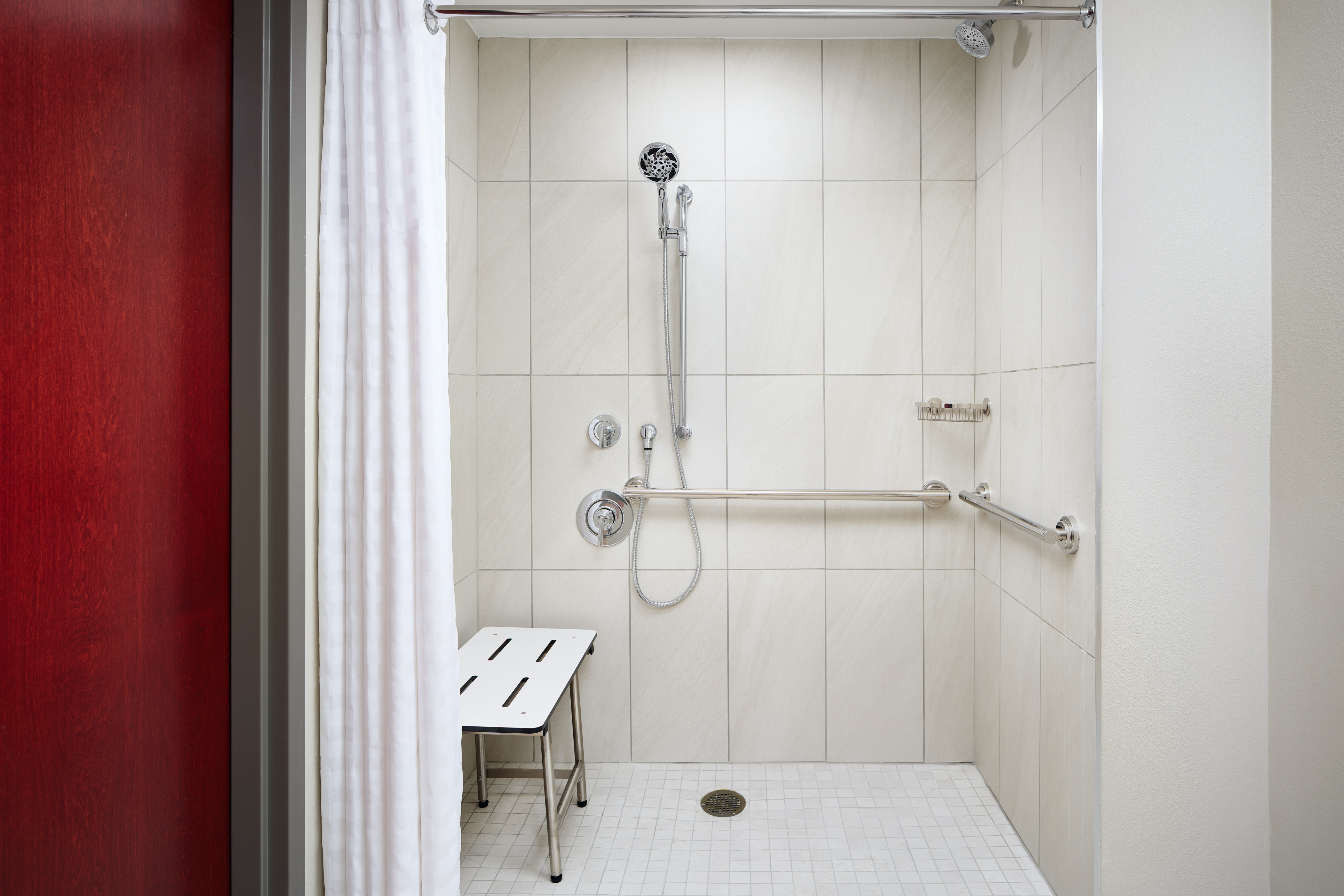 Bathroom with shower and seat