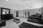 fitness center with exercise machines and weights