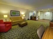 Accessible King Suite with Lounge Area, Room Technology, and Work Desk