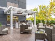 Patio area with soft seating and BBQ grills