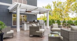 Patio area with soft seating and BBQ grills