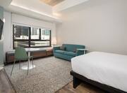 Queen Bed in Suite with HDTV and City View